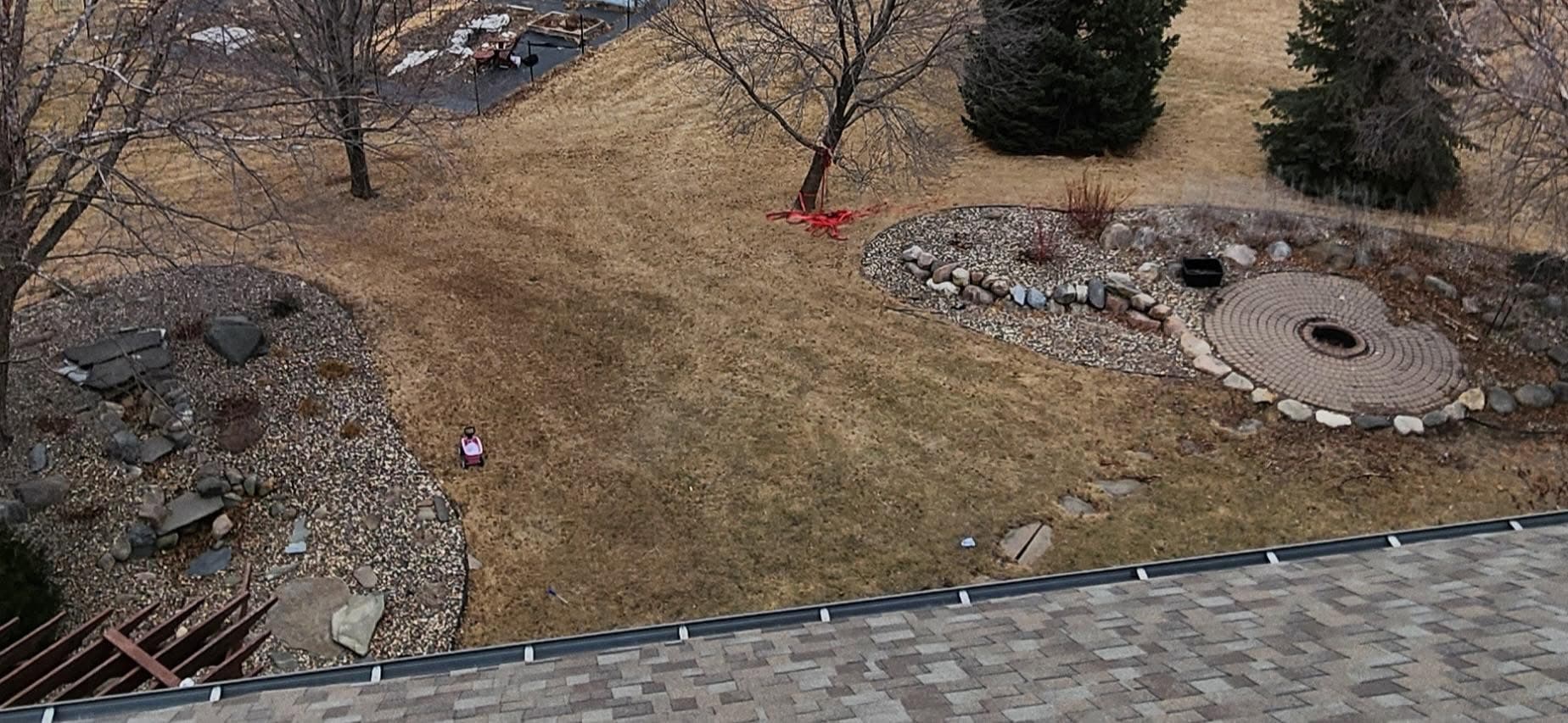 Aerial view of a yard with a boulder feature