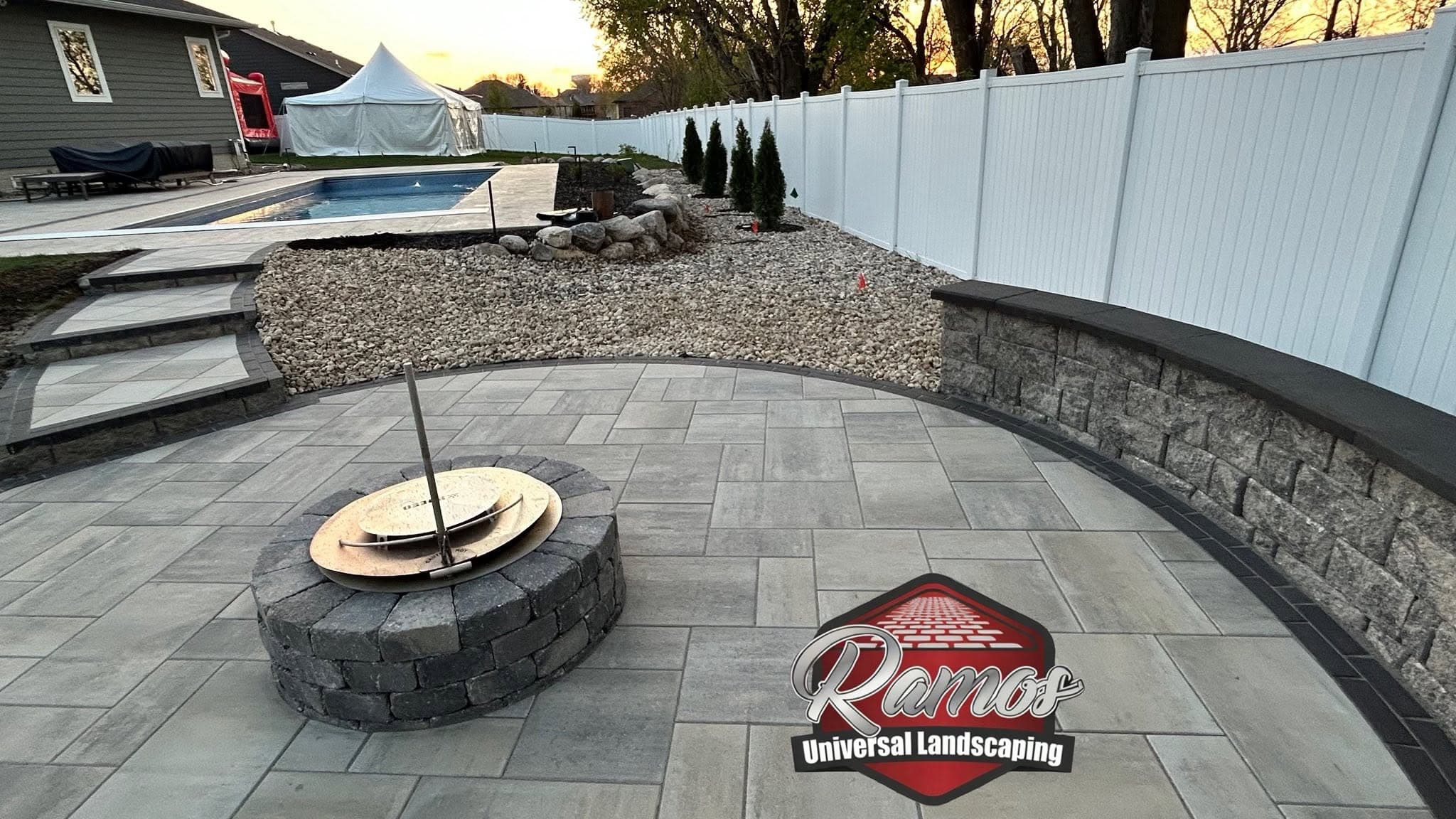 Finished fire pit patio beside a pool