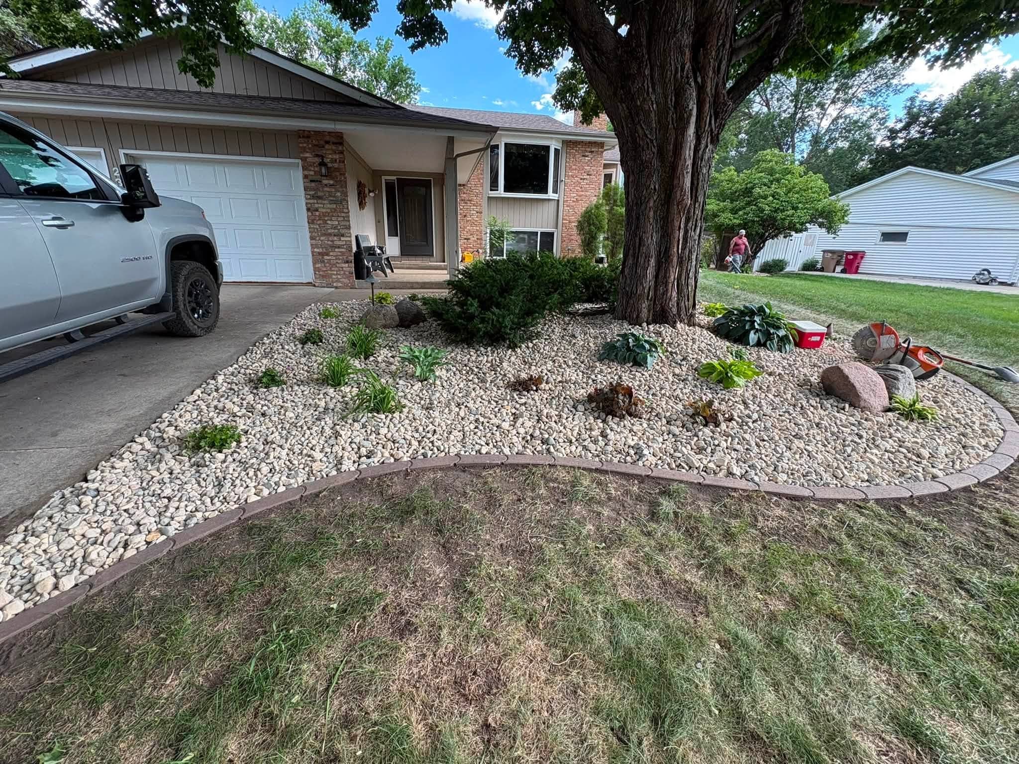 Rock island bed around a front yard tree