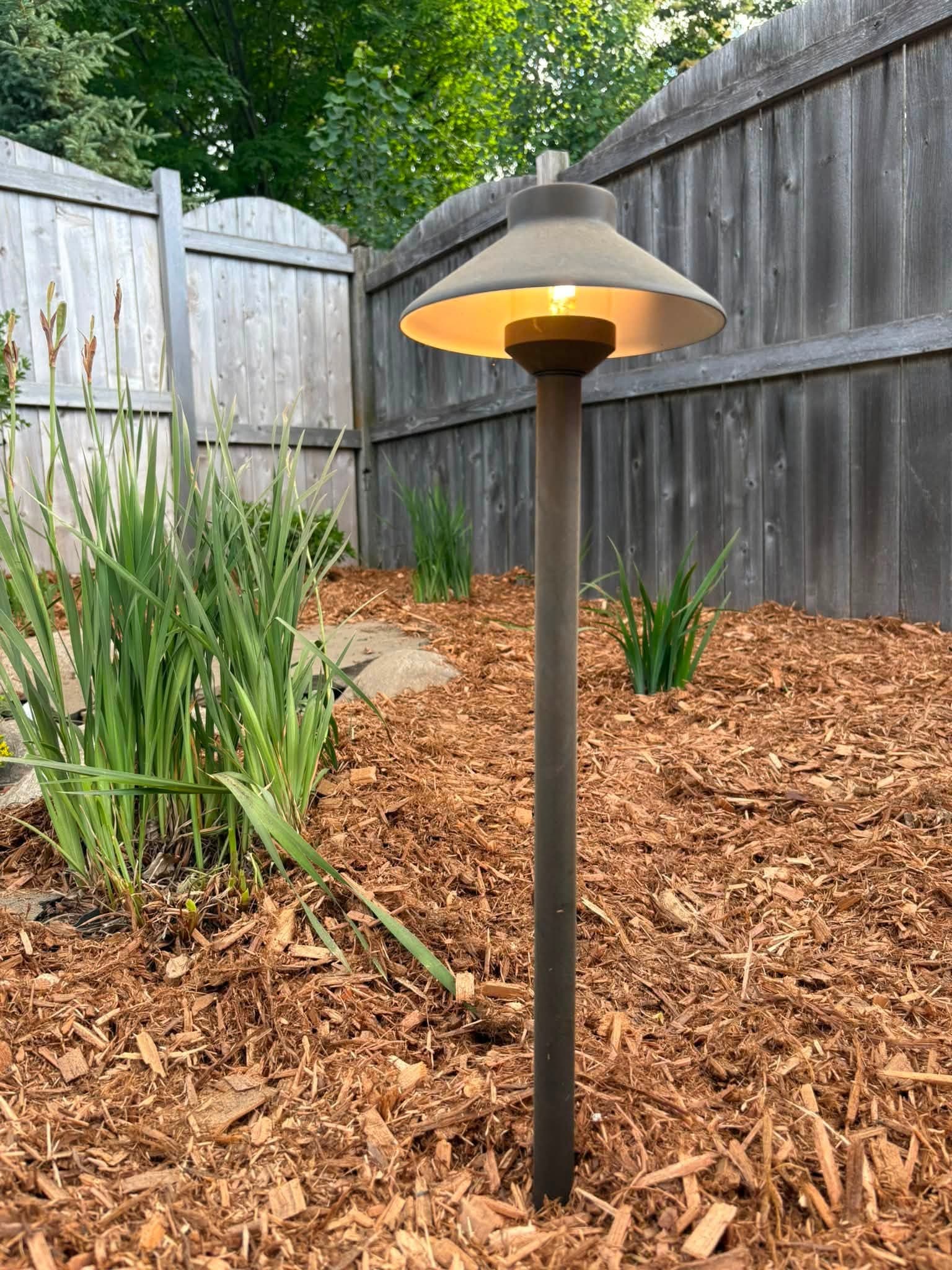 Path light set in a fresh mulch bed