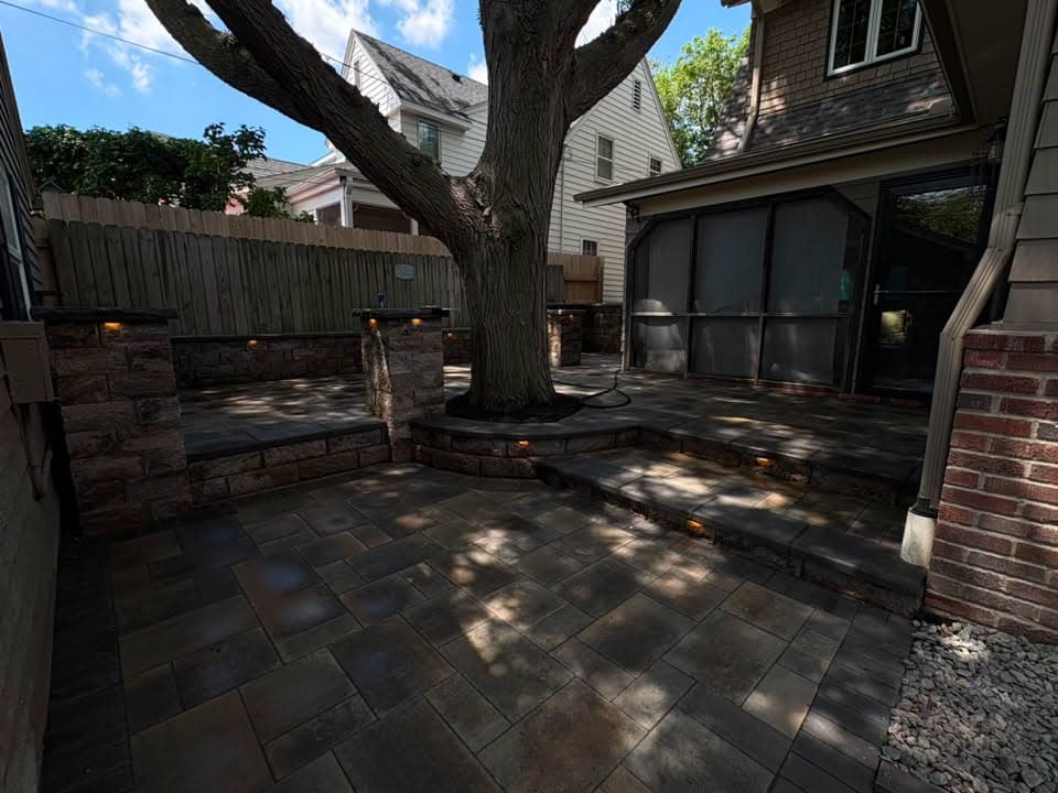Seat wall lighting around a patio tree