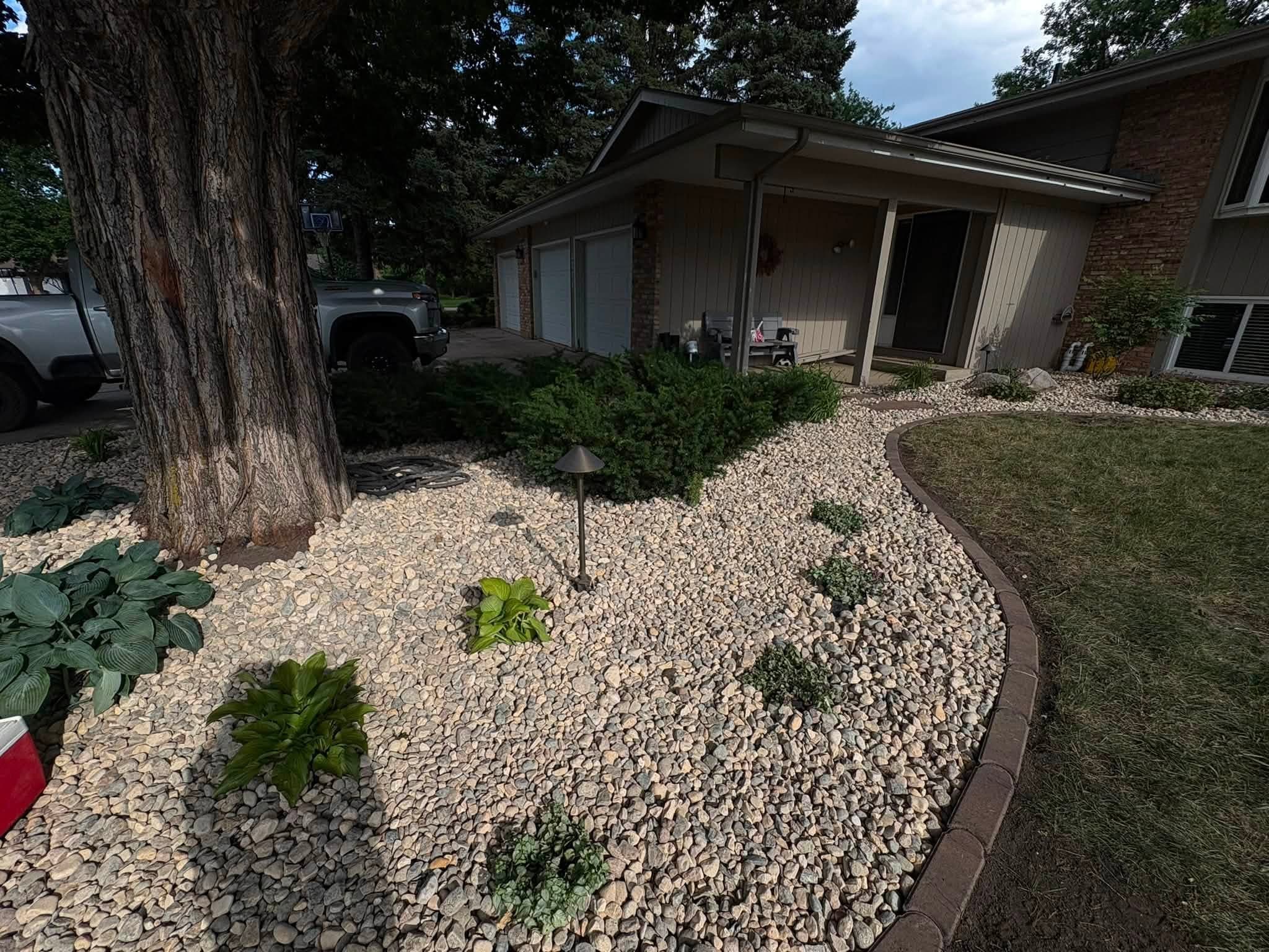 Tree ring rock bed with edging