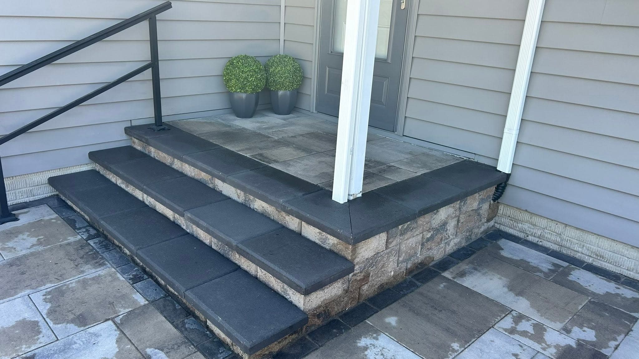 Finished paver front steps and stoop at a home entry