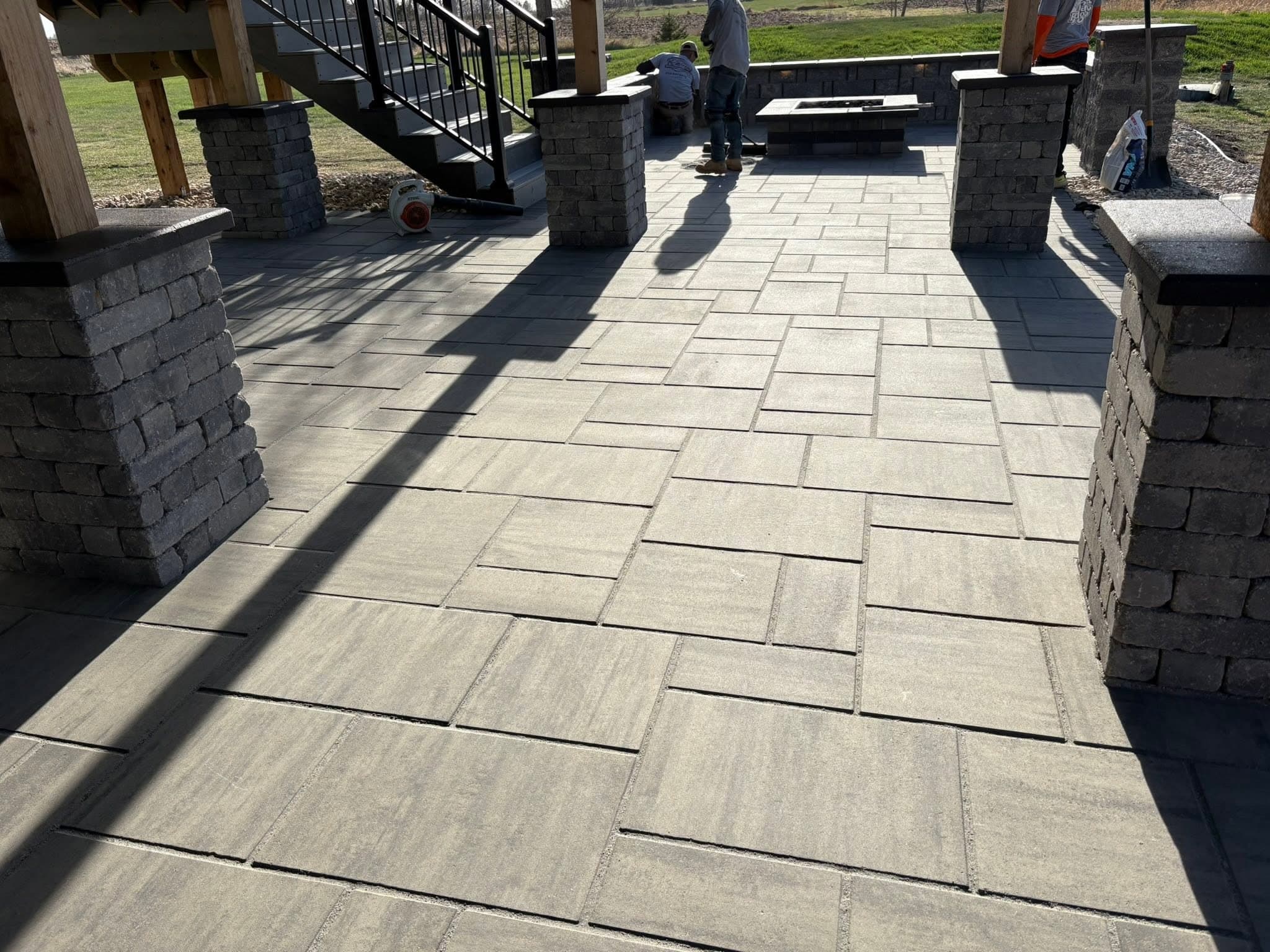 Wide view of a paver patio with block walls