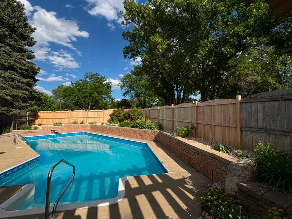Retaining wall and landscaping around a pool